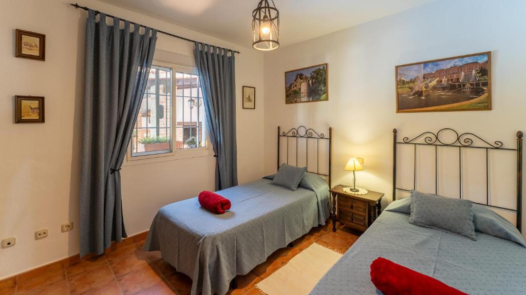 Postel nebo postele na pokoji v ubytování Casa Rocío