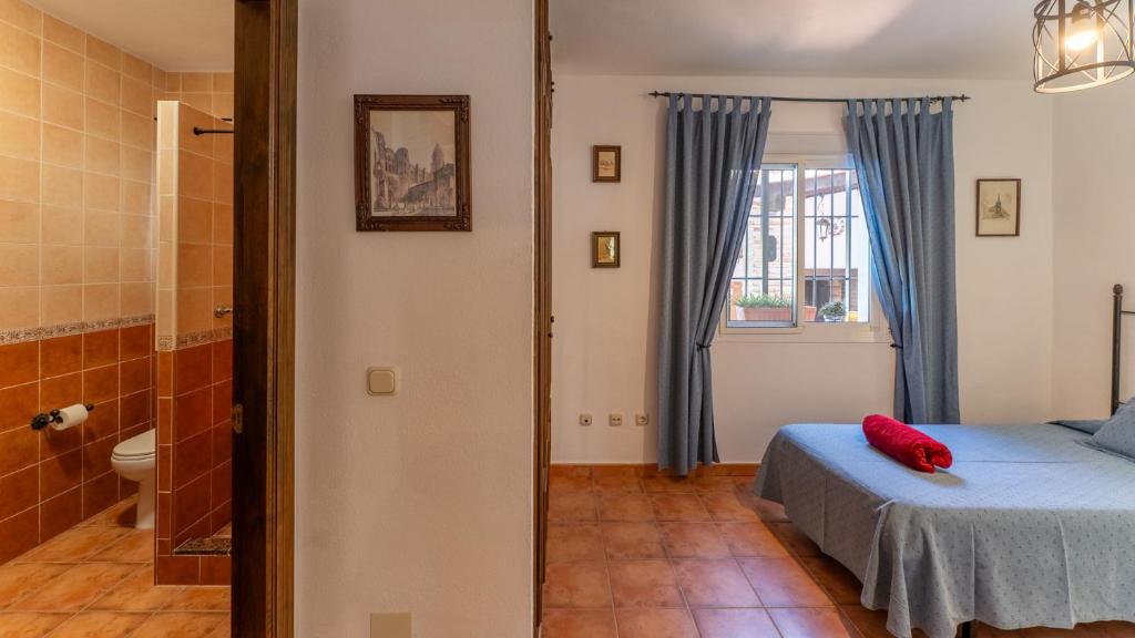 Postel nebo postele na pokoji v ubytování Casa Rocío