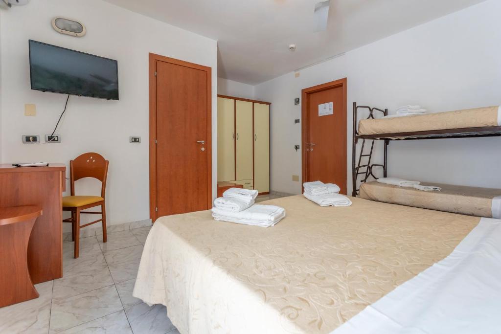 Postel nebo postele na pokoji v ubytování Hotel Clipper