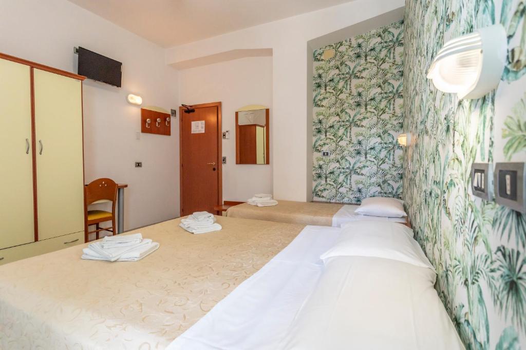 Postel nebo postele na pokoji v ubytování Hotel Clipper
