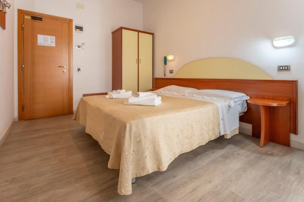 Postel nebo postele na pokoji v ubytování Hotel Clipper