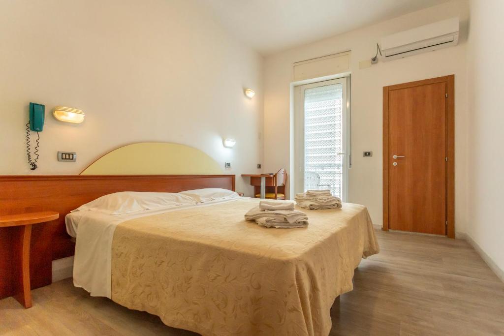 Postel nebo postele na pokoji v ubytování Hotel Clipper