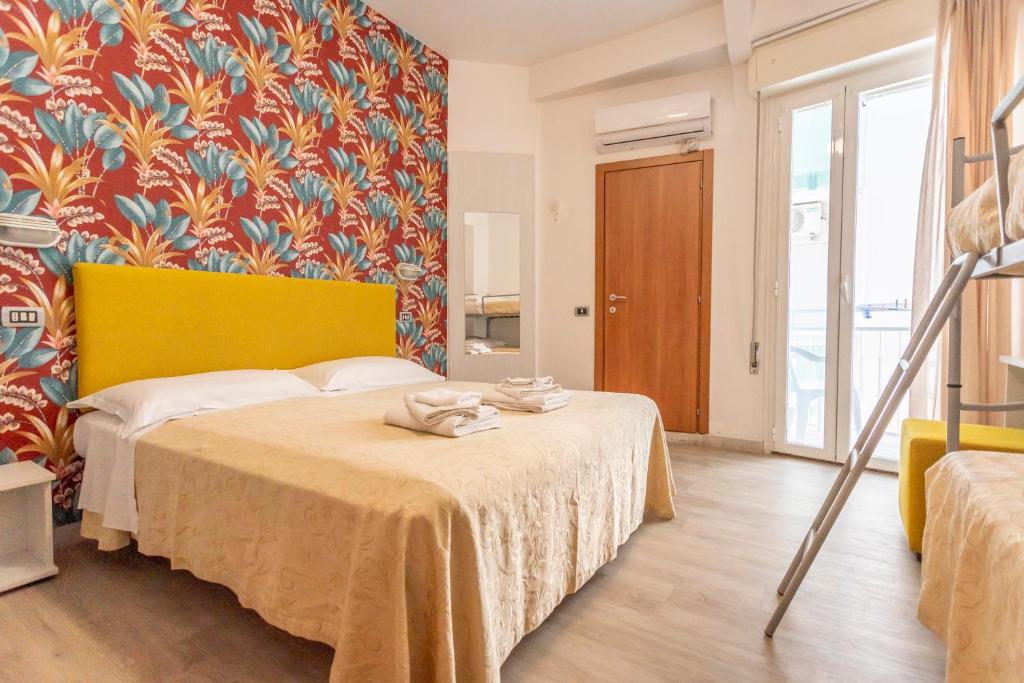 Postel nebo postele na pokoji v ubytování Hotel Clipper