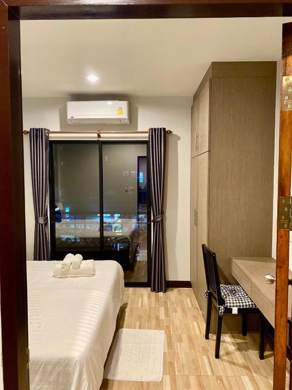 Postel nebo postele na pokoji v ubytování Hm House Patong