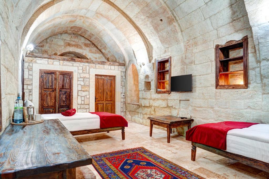 Postel nebo postele na pokoji v ubytování Cappadocia Kemer Palace