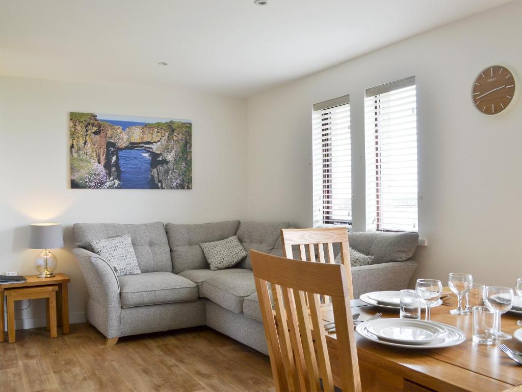 a living room with a couch and a table at Rockworks Chalets No2 - Uk7041 in Saint Marys