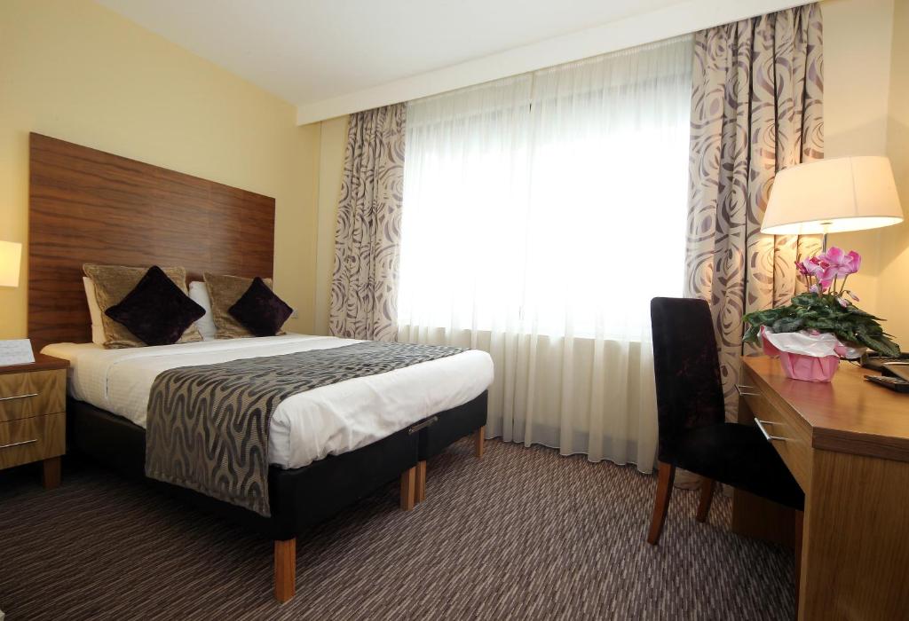 Postel nebo postele na pokoji v ubytování Gresham Belson Hotel Brussels