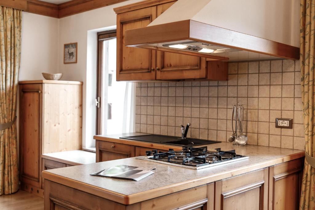 Kuchyň nebo kuchyňský kout v ubytování Appartamenti Al Bivio