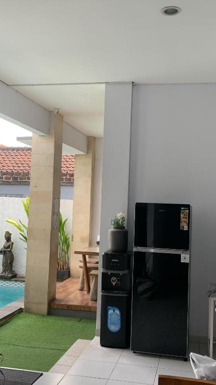 Postel nebo postele na pokoji v ubytování Chua Guest house Canggu