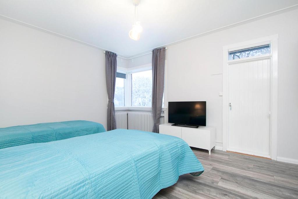 Postel nebo postele na pokoji v ubytování Nordurey Guesthouse