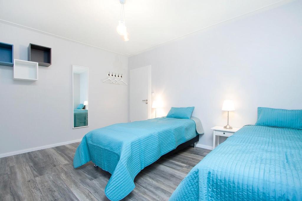 Postel nebo postele na pokoji v ubytování Nordurey Guesthouse