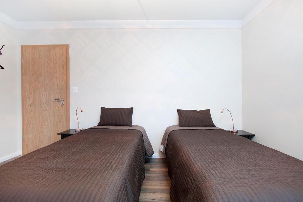 Postel nebo postele na pokoji v ubytování Nordurey Guesthouse