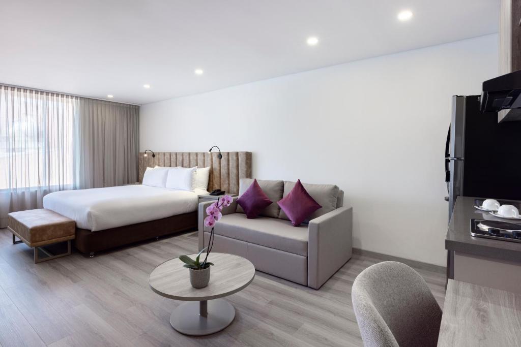 Postel nebo postele na pokoji v ubytování Hotel Jazz Apartments