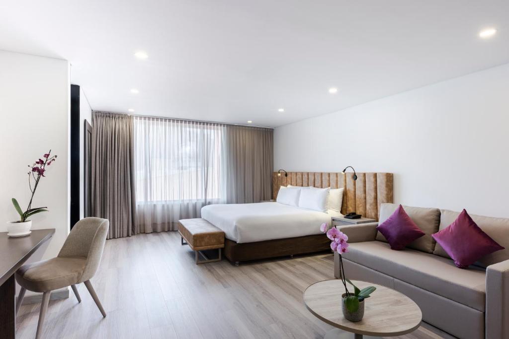 Postel nebo postele na pokoji v ubytování Hotel Jazz Apartments
