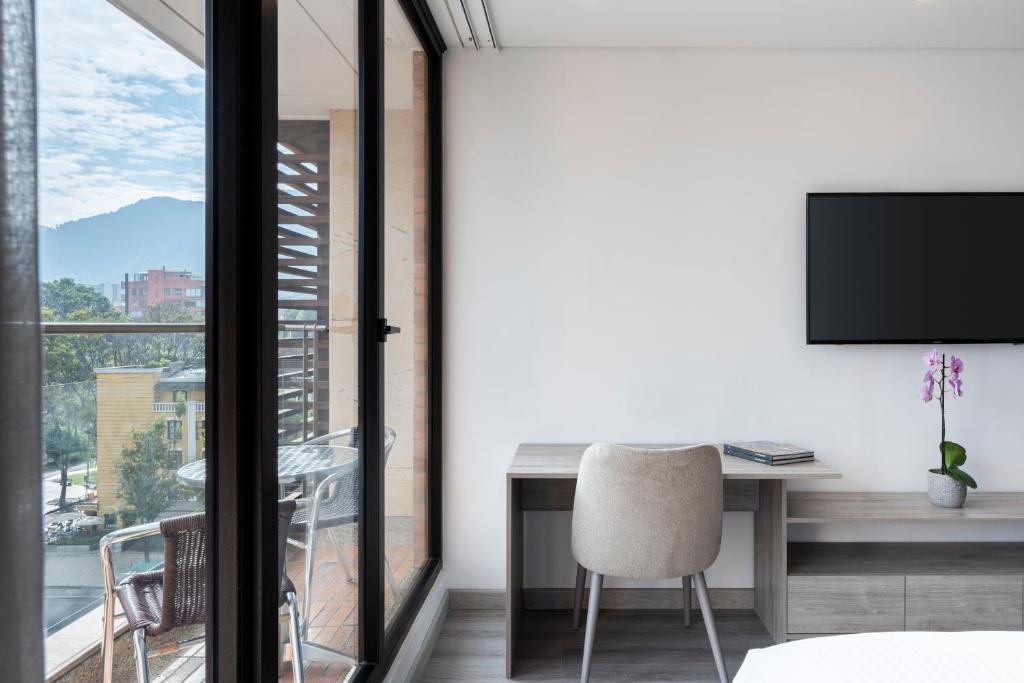 TV a/nebo společenská místnost v ubytování Hotel Jazz Apartments
