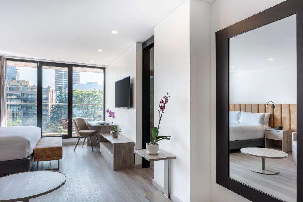 Postel nebo postele na pokoji v ubytování Hotel Jazz Apartments