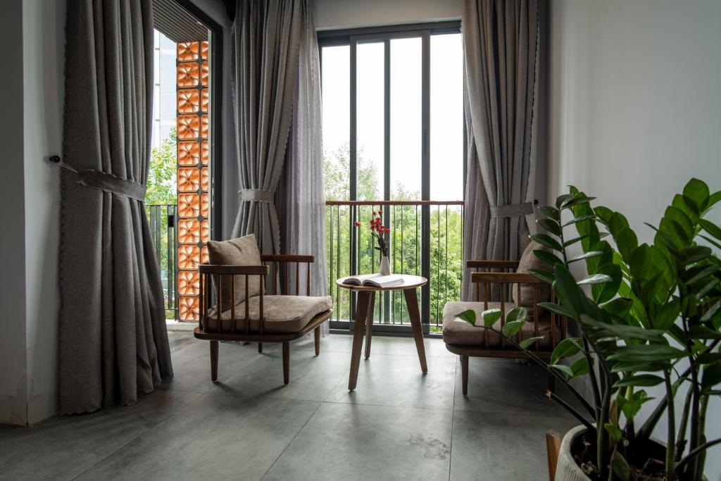 Posezení v ubytování DOMA by HSuites Hotel & Apartment