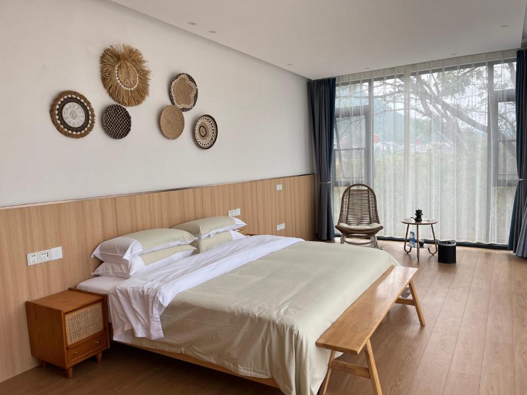 Postel nebo postele na pokoji v ubytování Yuan Meng Town