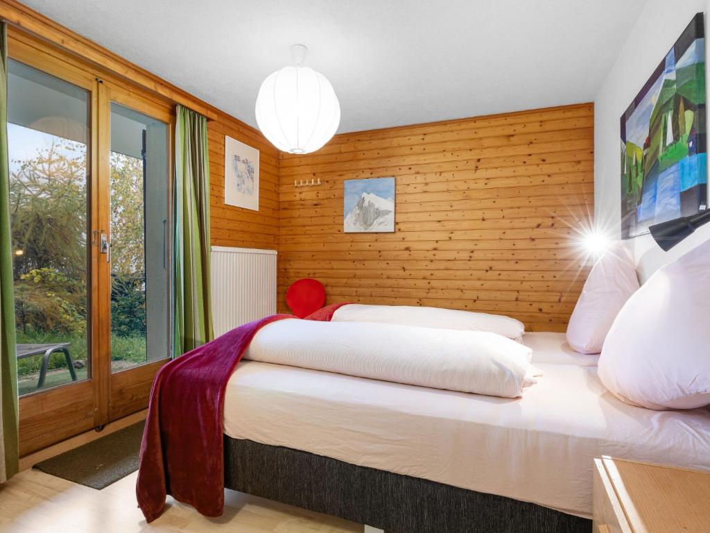 Postel nebo postele na pokoji v ubytování Chalet Rietsli by Interhome