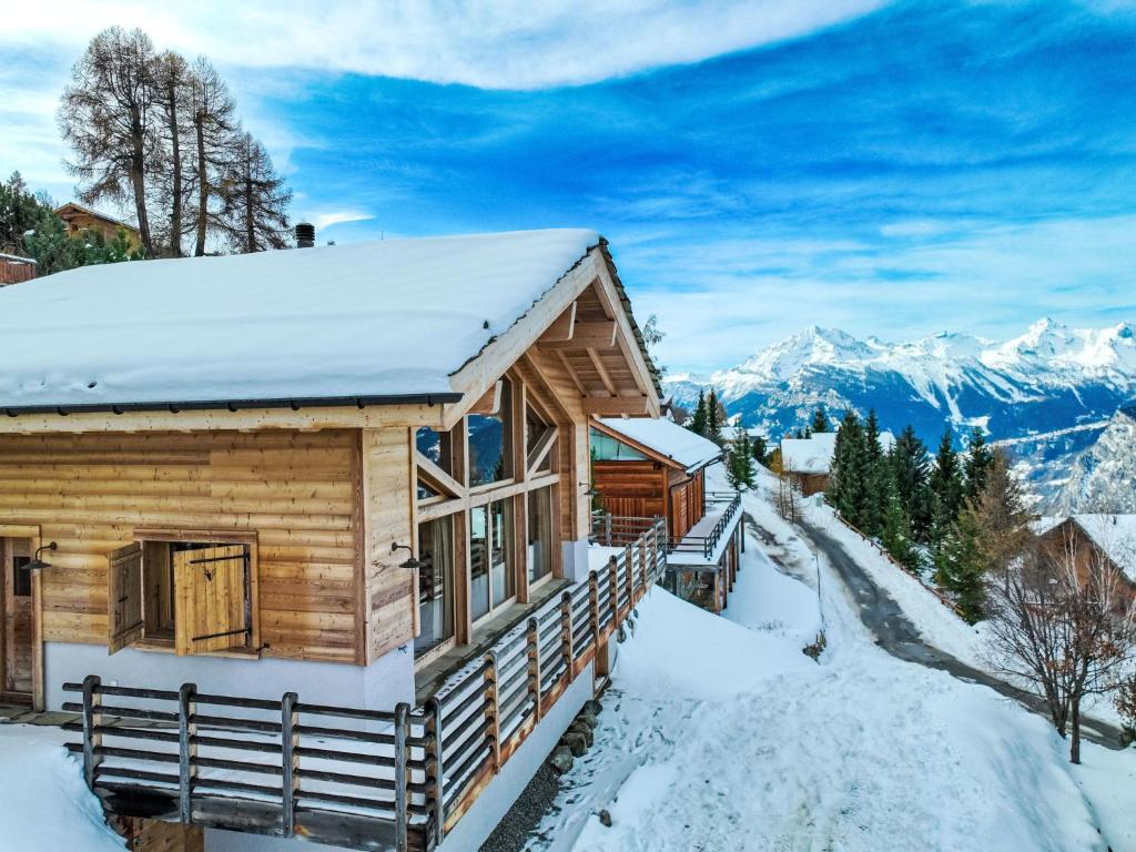 a log cabin in the mountains in the snow at Chalet Chalet Jadi by Interhome in Nendaz