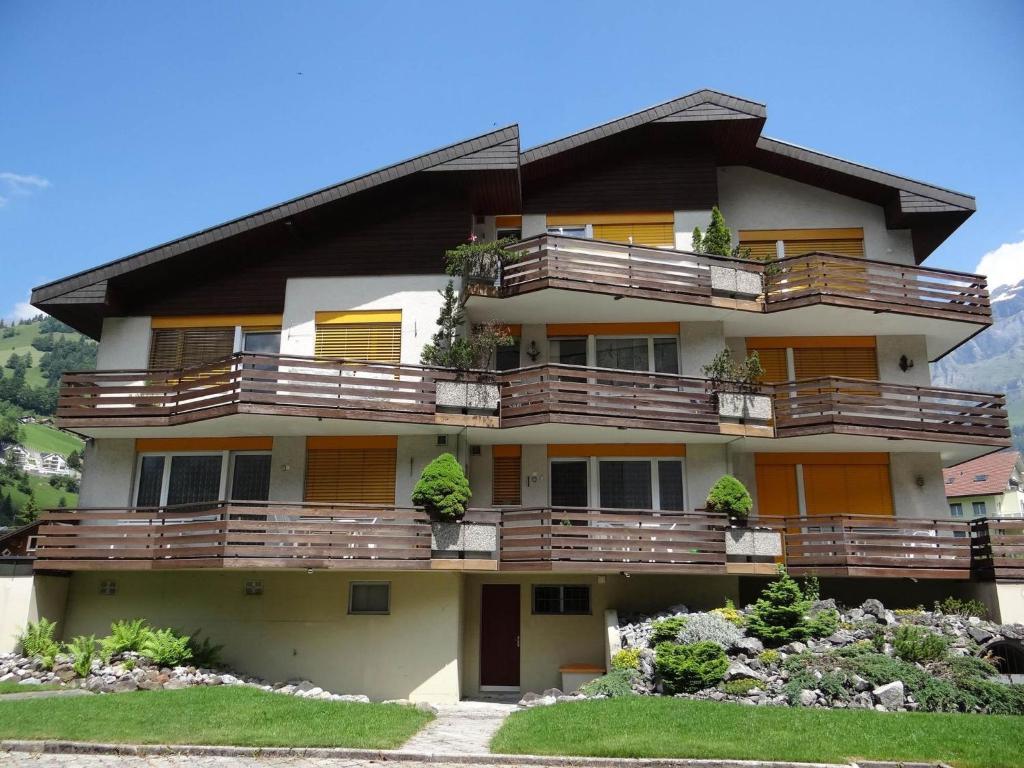 a building with balconies and plants on it at Apartment Birkenstrasse 52 by Interhome in Engelberg