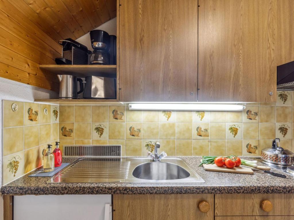 Kuchyň nebo kuchyňský kout v ubytování Apartment Eiger Residence Apt-A-425 by Interhome