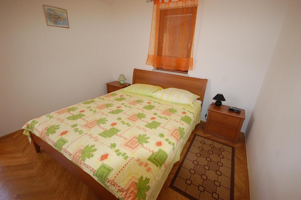 Łóżko lub łóżka w pokoju w obiekcie Apartment Grozic