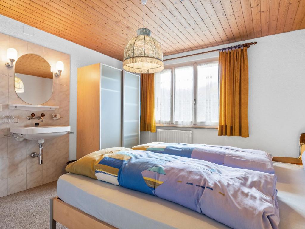 Ένα ή περισσότερα κρεβάτια σε δωμάτιο στο Apartment Heimine by Interhome