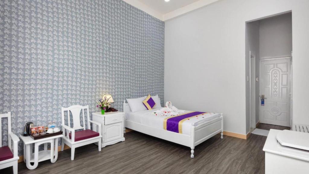 Postel nebo postele na pokoji v ubytování CCT Luxury Hotel