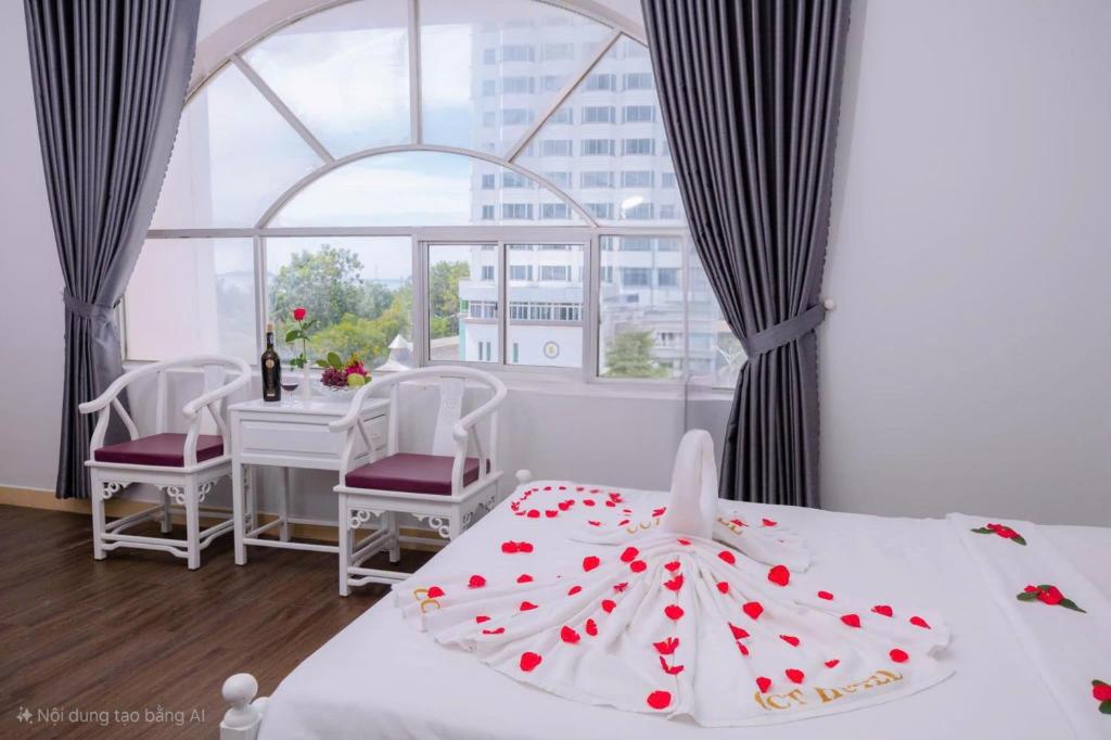 Postel nebo postele na pokoji v ubytování CCT Luxury Hotel