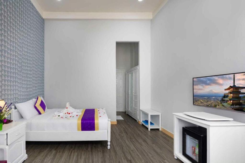 Postel nebo postele na pokoji v ubytování CCT Luxury Hotel