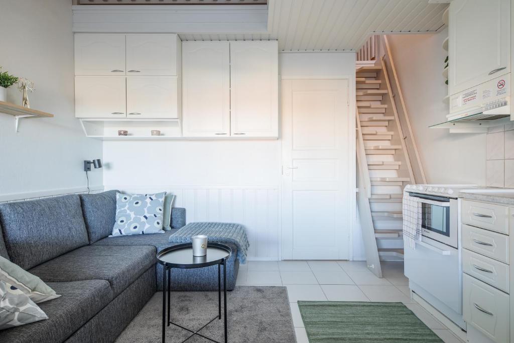 a small living room with a couch and a table at Moonlight 214 in Levi