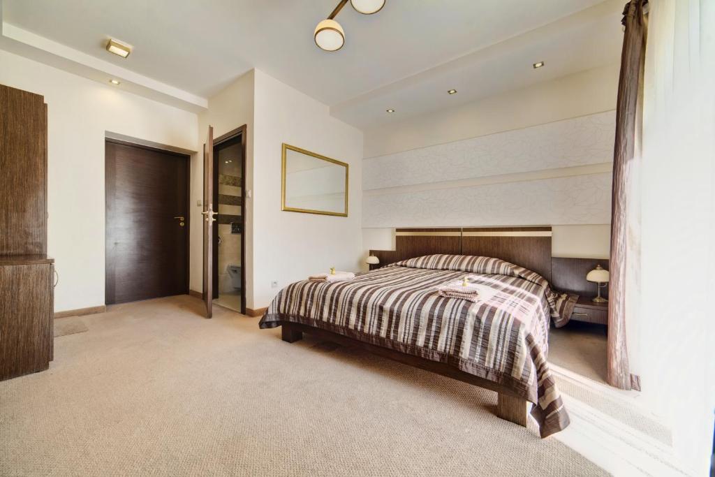 Posteľ alebo postele v izbe v ubytovaní Hotel Orlik