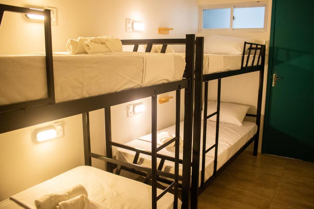 Postel nebo postele na pokoji v ubytování Grand'Hostel