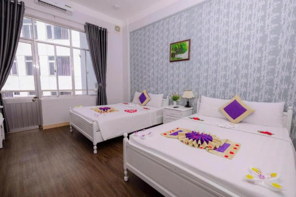 Postel nebo postele na pokoji v ubytování CCT Luxury Hotel