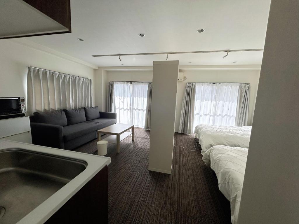 Postel nebo postele na pokoji v ubytování 山中ビル3Fーワンフロア貸切48平方メートルone floor private room