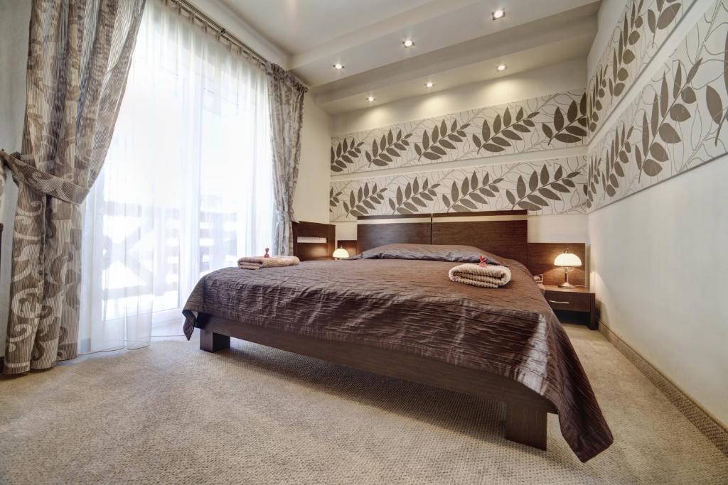 Posteľ alebo postele v izbe v ubytovaní Hotel Orlik
