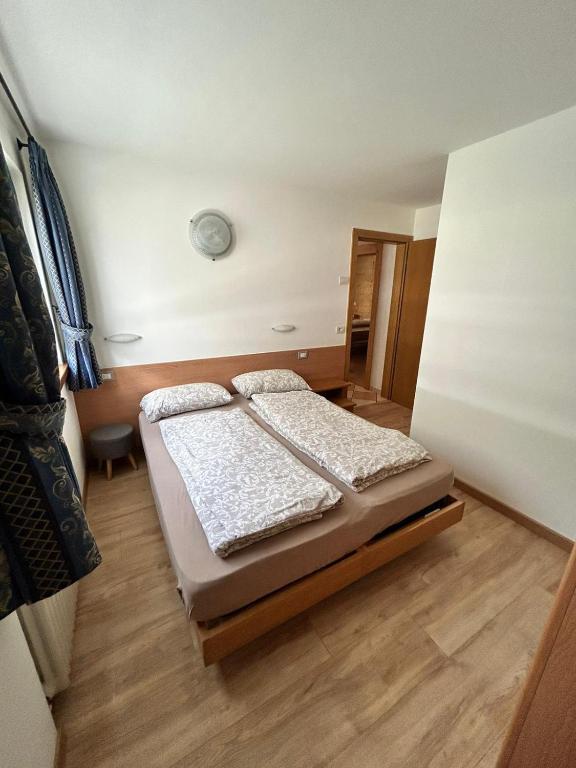 Postel nebo postele na pokoji v ubytování Appartamento Cima Cavalli
