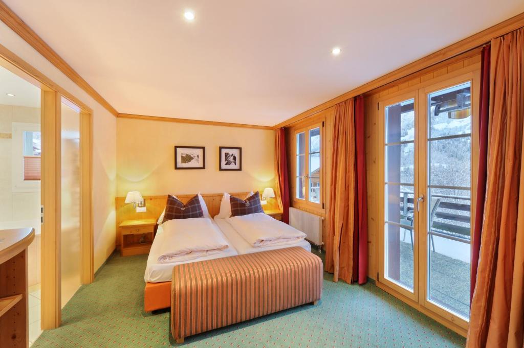 Postel nebo postele na pokoji v ubytování Hotel Kirchbühl Superior