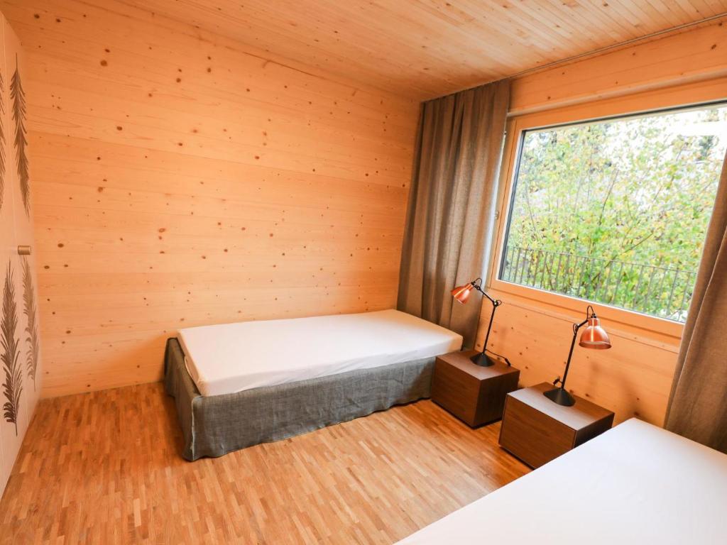 Postel nebo postele na pokoji v ubytování Apartment Brunnhorn EG Nordost by Interhome