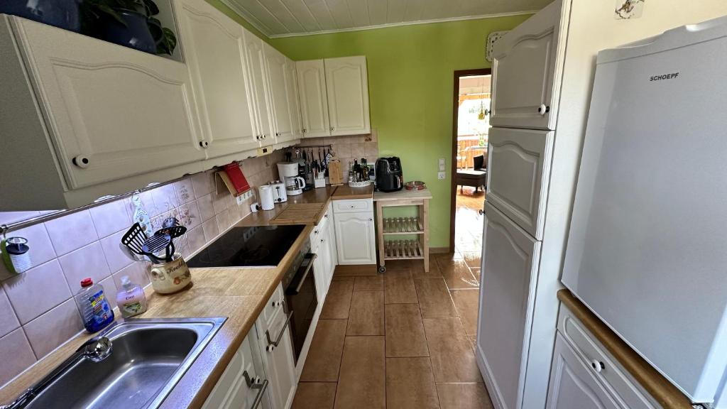 Kuchyň nebo kuchyňský kout v ubytování Gästezimmer zum Waldsachsener Grund