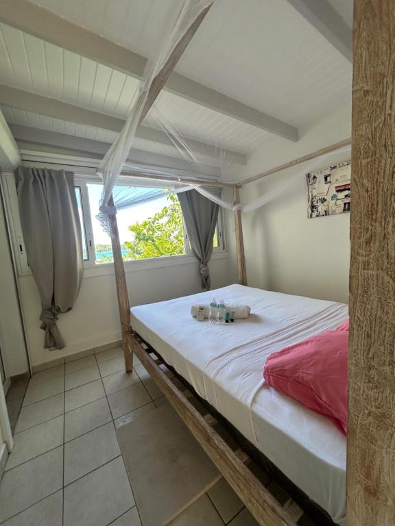 Postel nebo postele na pokoji v ubytování Grand Case Palace