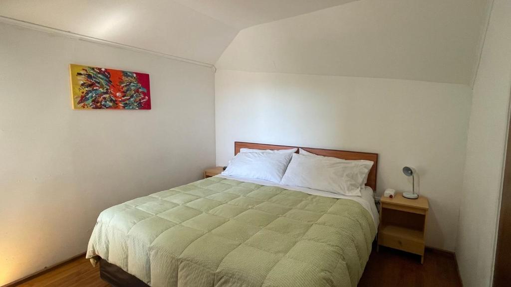 Postel nebo postele na pokoji v ubytování Hostal Recreo