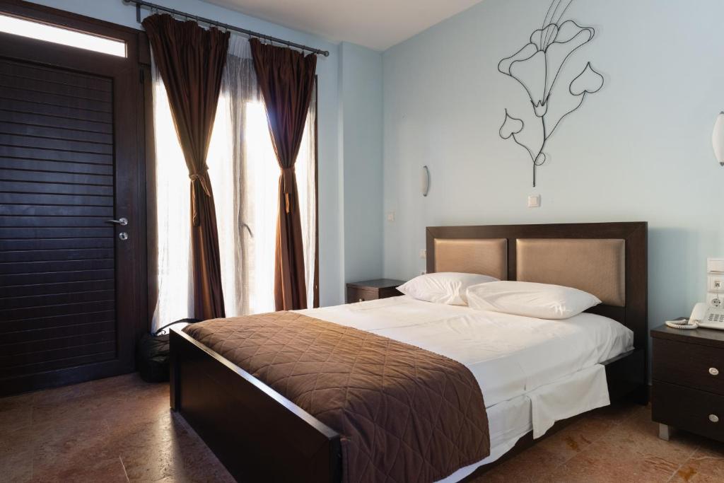 Postel nebo postele na pokoji v ubytování Hotel Makednos
