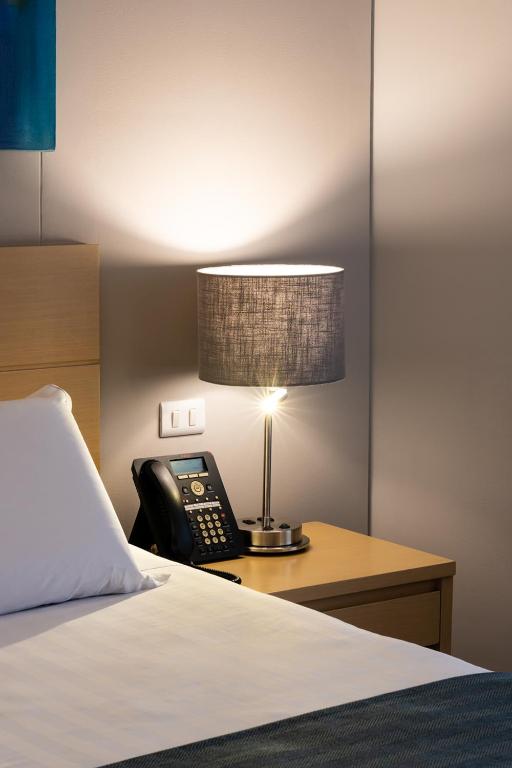 Postel nebo postele na pokoji v ubytování Hotel Estelar Blue