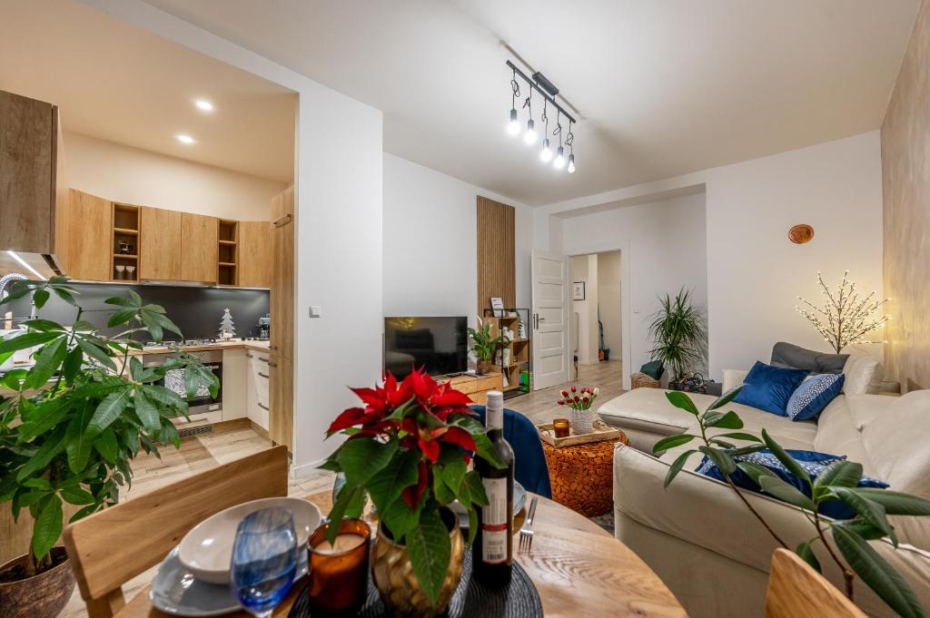 a living room with a couch and a table at Garbo 3 bedroom Kosice Centrum Very NEW in Košice