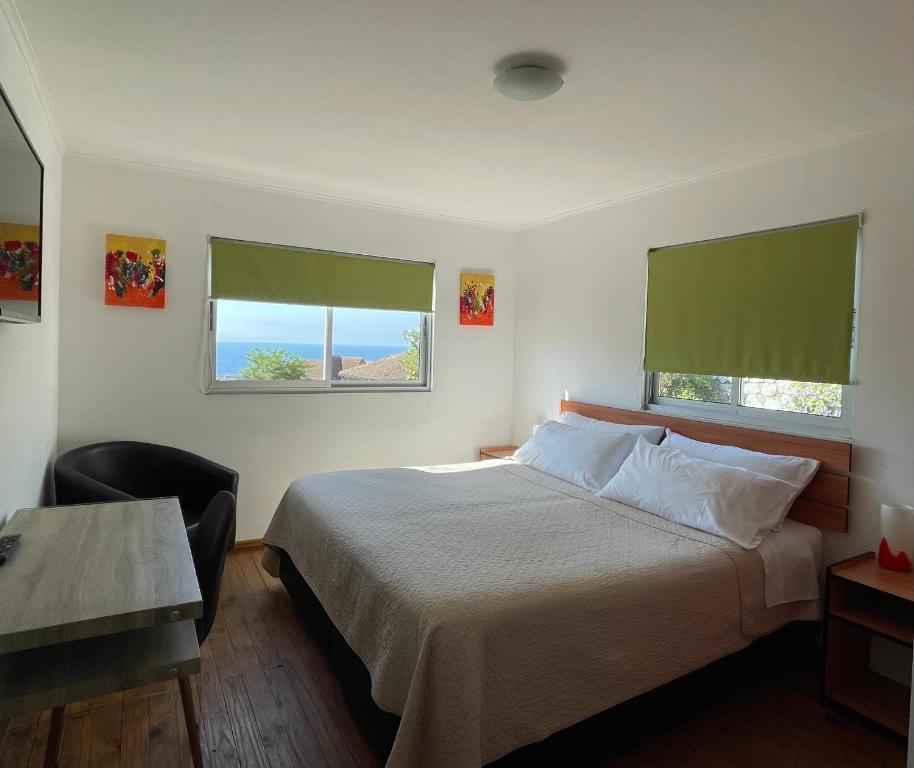 Postel nebo postele na pokoji v ubytování Hostal Recreo