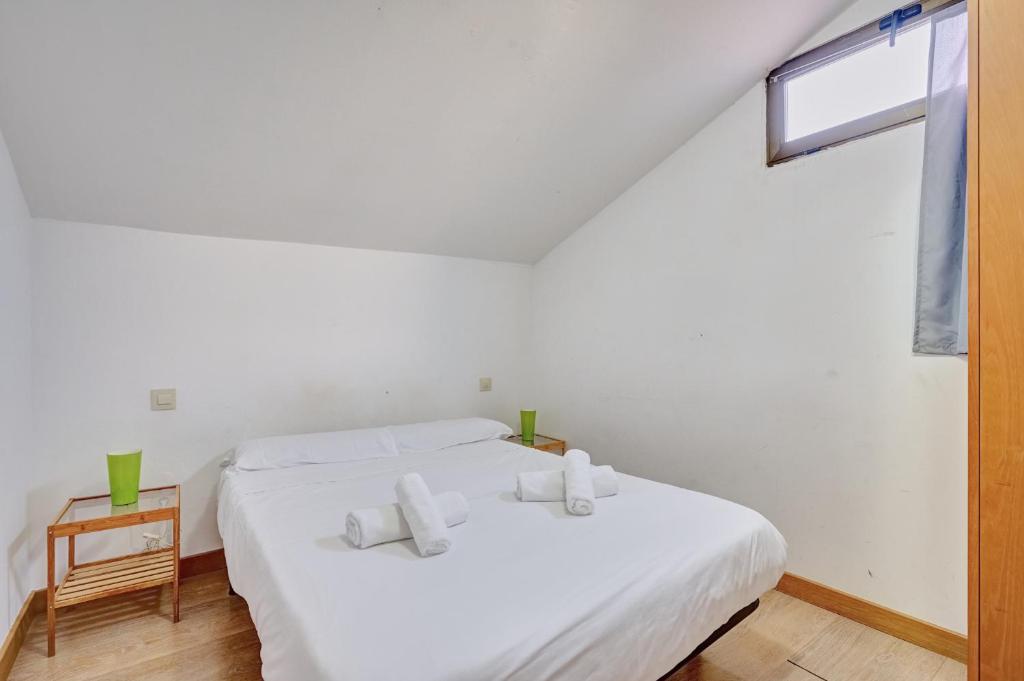 A bed or beds in a room at Estudio Haro