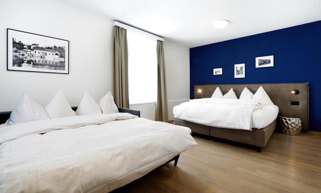 Postel nebo postele na pokoji v ubytování Hotel Zugertor