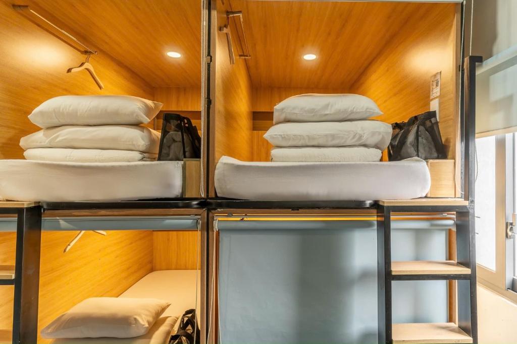 Postel nebo postele na pokoji v ubytování Amango Dorm